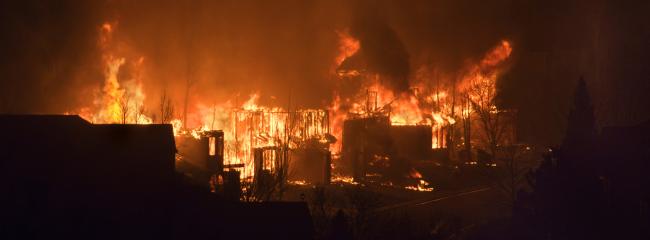 Wildfires in the wildland-urban interface have caused catastrophic structural damage. (Photograph courtesy of iStock.com/milehightraveler)